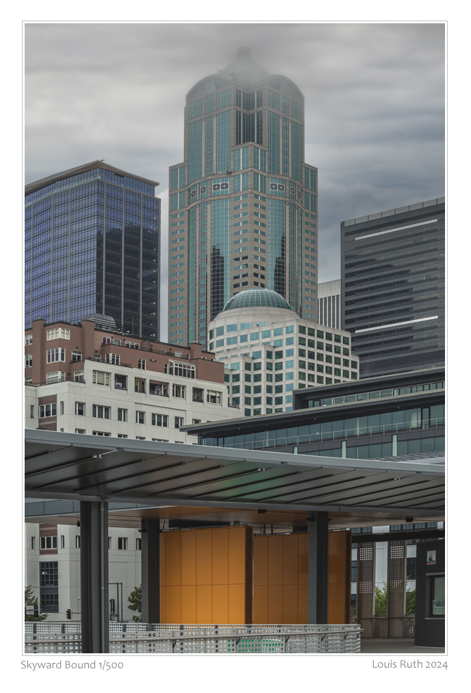 LouisRuth2024's tweet photo. Skyward Bound 
As the morning clouds drift through Seattle, I photographed this group of buildings in a vertical perspective. The green glass building stretches into the sky and dissapears in the clouds.
-
#Seattle #Seattlestreets #seattlephotographer #louisruthphotography #urban https://t.co/8i1TLOyTOC