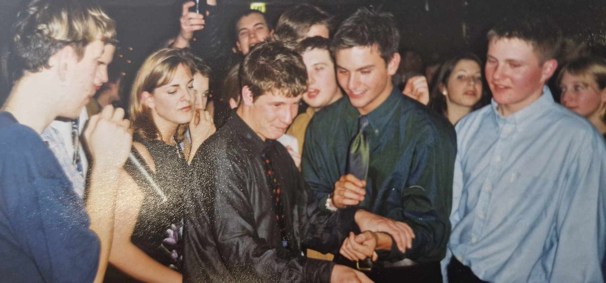 Jessdunsdon's tweet photo. A school friend sent me this today. 
I do not know:

*Where I am…
*How old I am…
*Who half these people are…
*Why the boys are wearing shirts…
*Am I even enjoying myself?

All a mystery! 

I do however know the dress is from warehouse 😂

The joy of going out in the 90s https://t.co/JclQSV2Fib