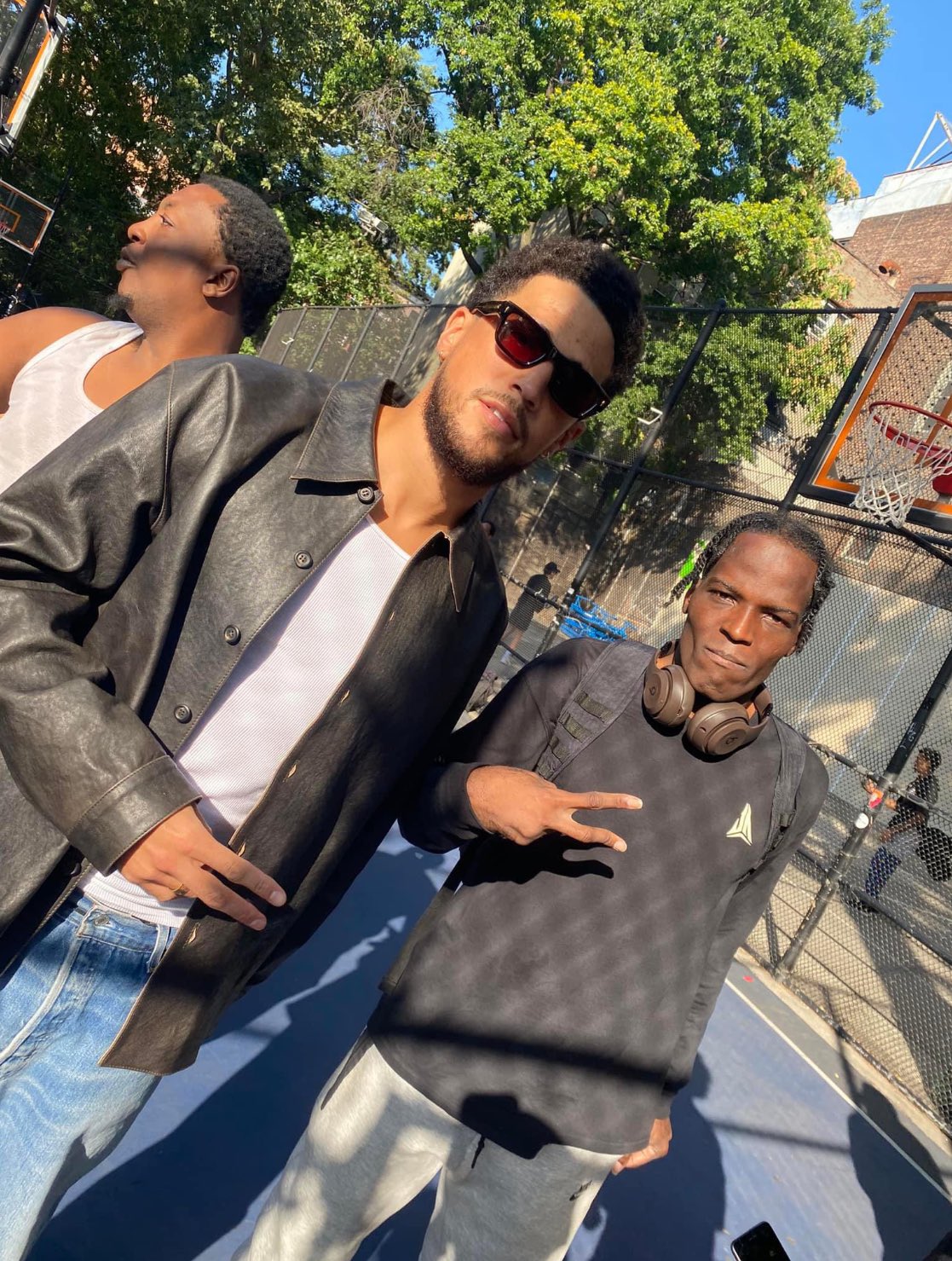 Kath on X Devin Booker wearing a leather jacket with no headband or hat on https t 8ajvO8e3vK X
