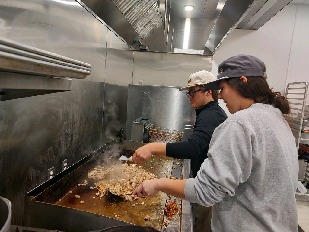 WestFelSchools's tweet photo. ProStart students are in action preparing delicious grilled chicken and baked potatoes for the WFHS football team.

#unitedwestfel #gratefel #wearewestfel #westfel #GoSaints https://t.co/z2GDIpy8R6