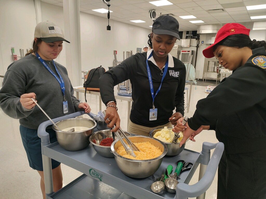WestFelSchools's tweet photo. ProStart students are in action preparing delicious grilled chicken and baked potatoes for the WFHS football team.

#unitedwestfel #gratefel #wearewestfel #westfel #GoSaints https://t.co/z2GDIpy8R6