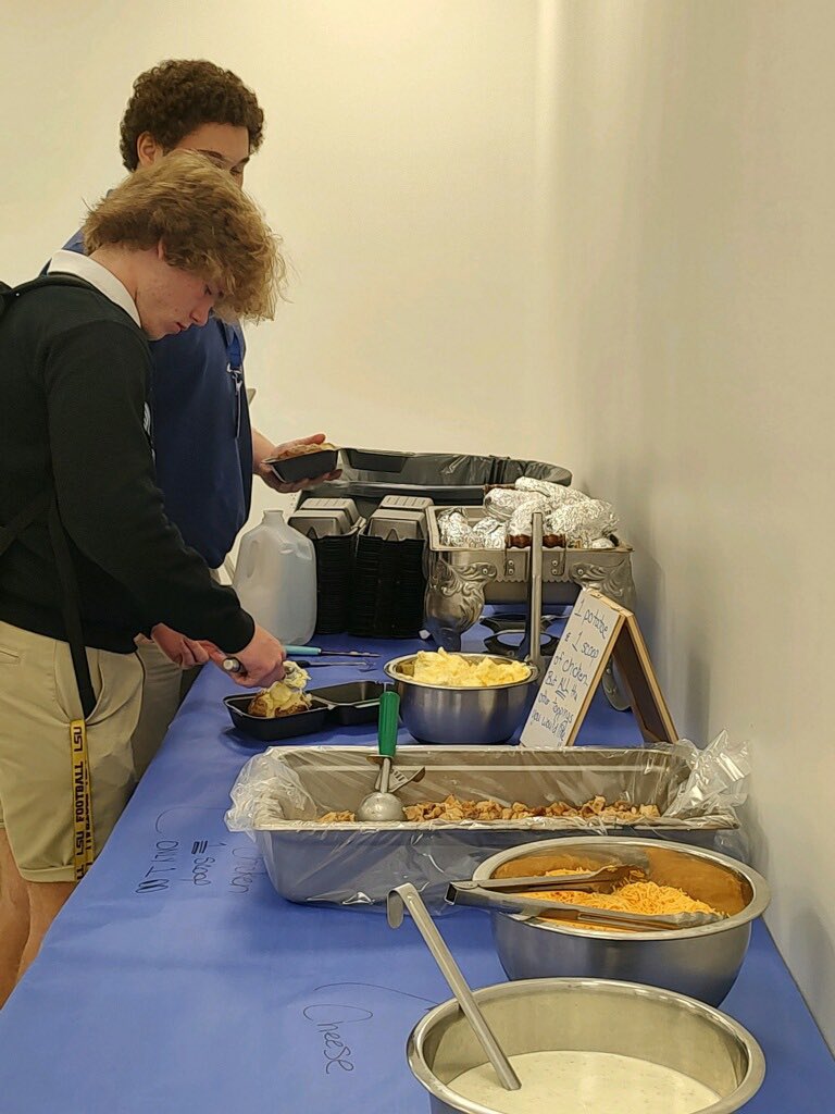 WestFelSchools's tweet photo. ProStart students are in action preparing delicious grilled chicken and baked potatoes for the WFHS football team.

#unitedwestfel #gratefel #wearewestfel #westfel #GoSaints https://t.co/z2GDIpy8R6