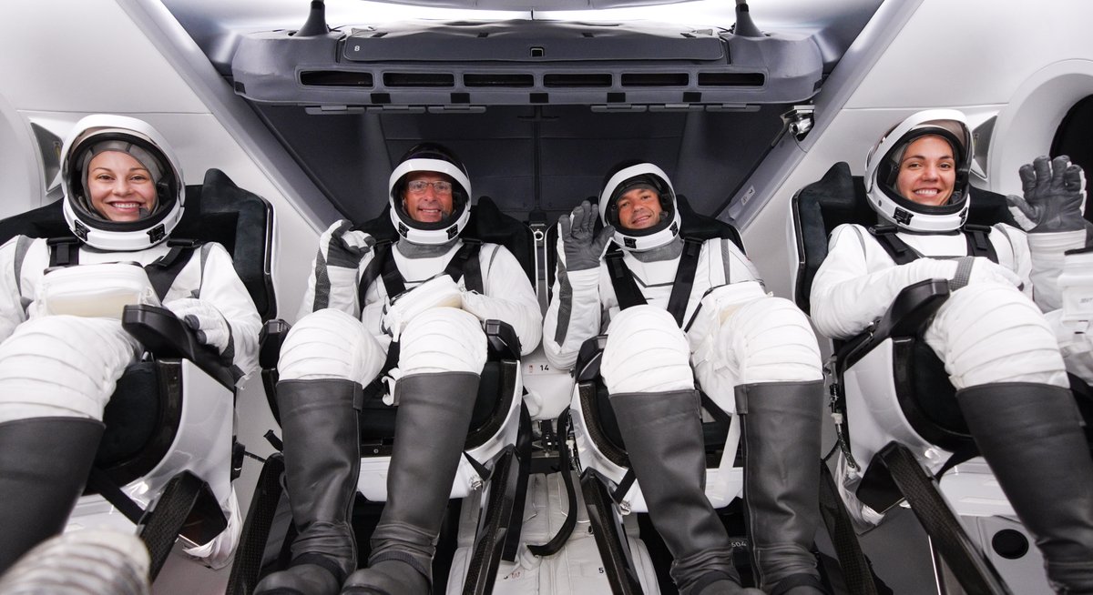 SpaceX's tweet image. Jared, Kidd, Sarah, and Anna walking down the crew arm ahead of entering Dragon