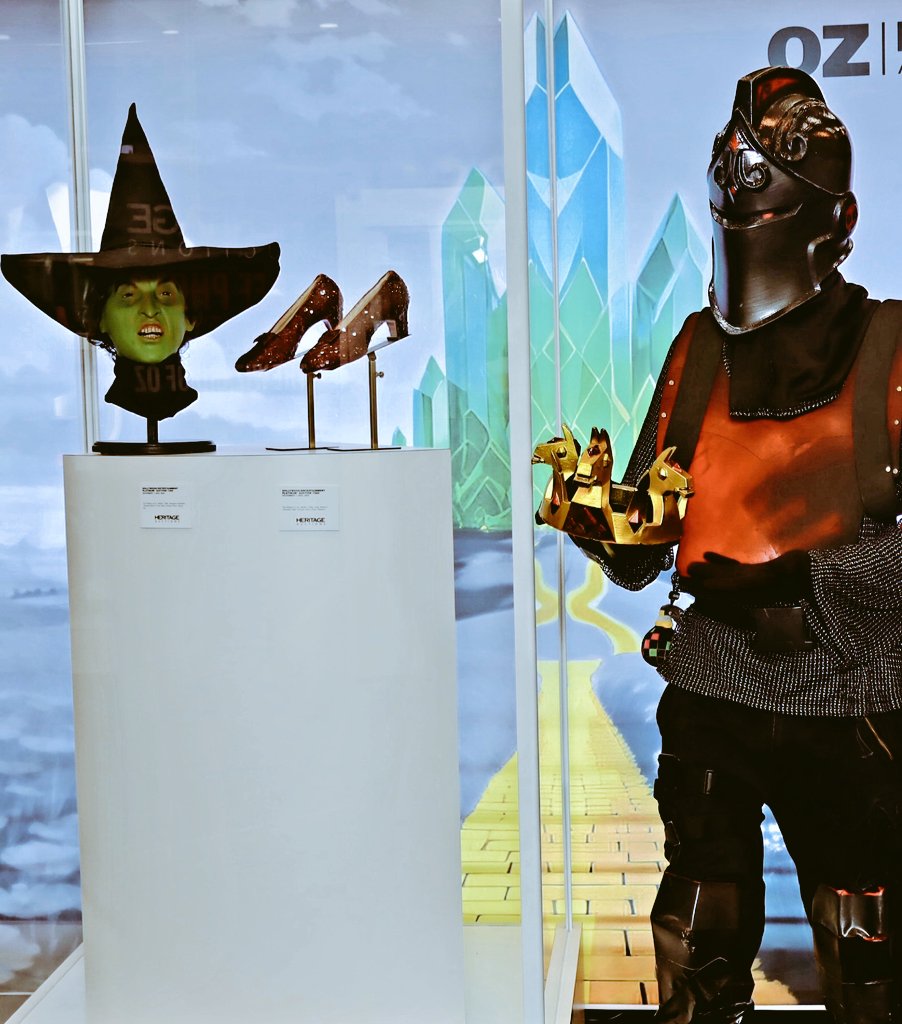Famous_player_'s tweet image. A while back at "The national sports card convention", I got to see the Ruby Red slippers from #wizardofoz. @heritageauctions always has some big stuff on display.

The slippers and witch hat are booth real movie used props. What would you rather have in your collection?