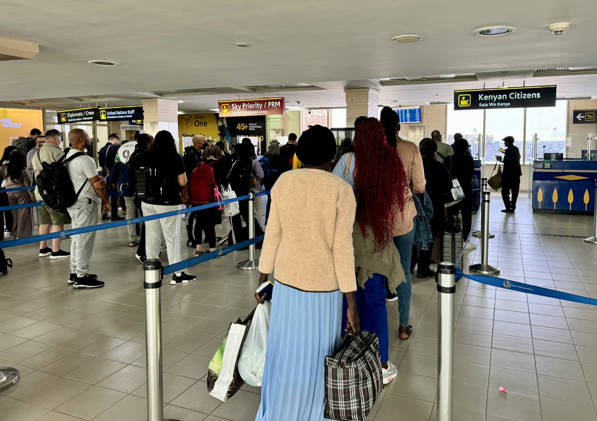 Rwandan citizens returning home simply scan their passports at smart gates to get in.

Kenyan citizens returning home queue up with foreigners for passport stamps