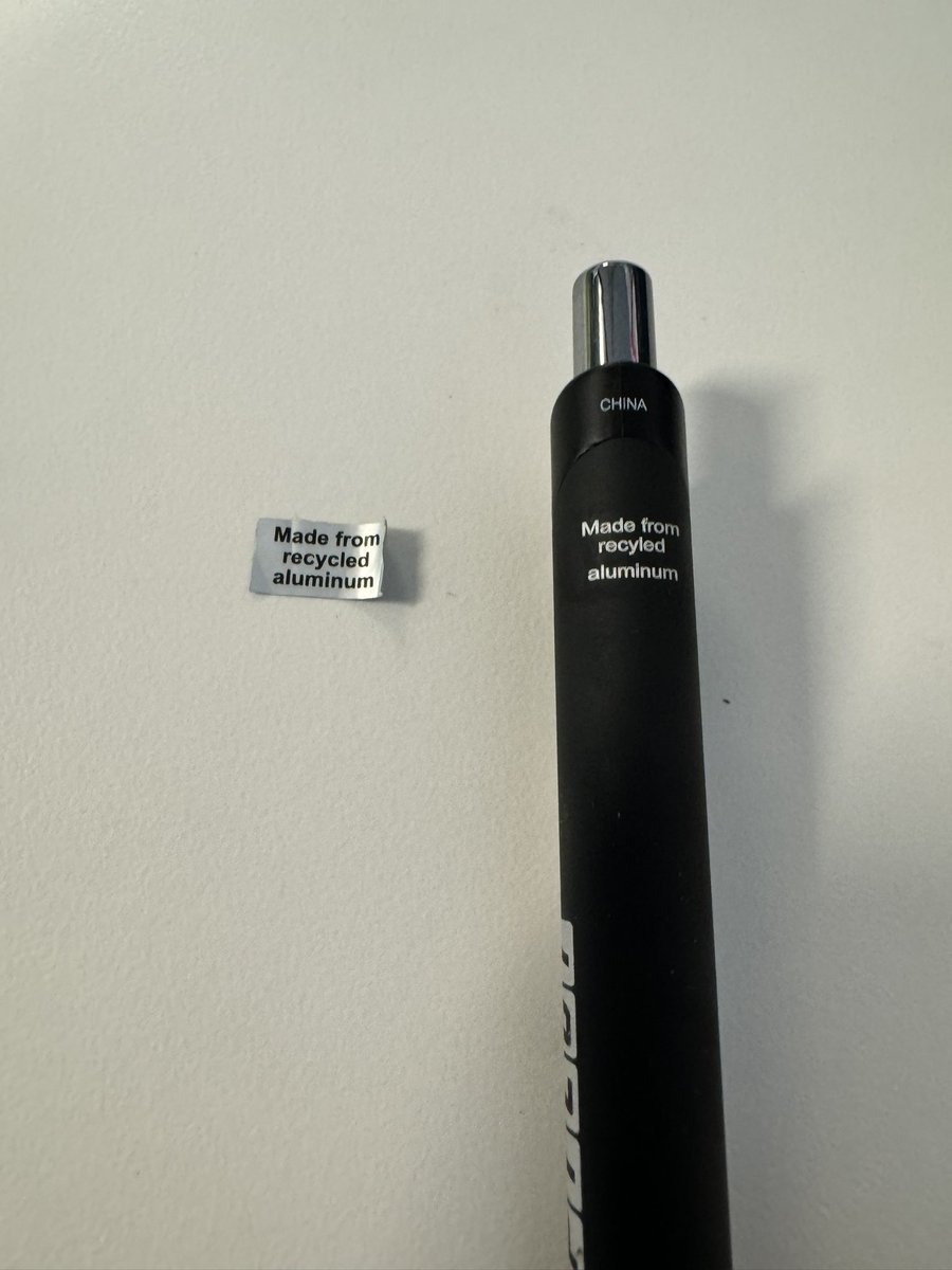 ryanthalverson's tweet photo. Pulled the “Made from recycled aluminum” sticker off my new pen. Underneath the sticker, the pen had been laser engraved with the same message. What’s the point of the sticker?  Ironic that a recycle sticker’s only purpose is creating more waste. https://t.co/AywON2vcDX