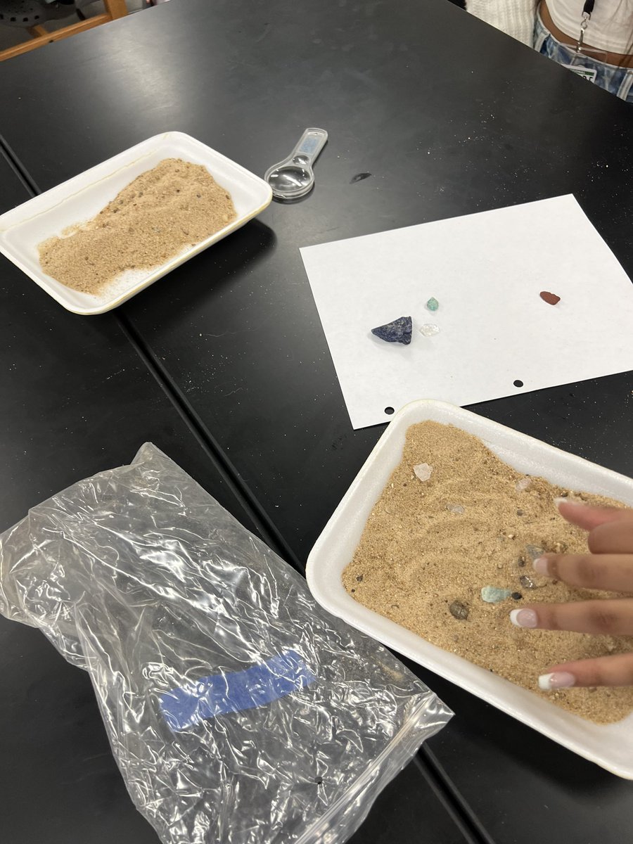 Students playing geologists today.  They received a bag of sand containing minerals, rocks, and fossils and they had to identify them using known samples, books, charts, and common characteristics.  🪨💎⛏️🧑‍🔬