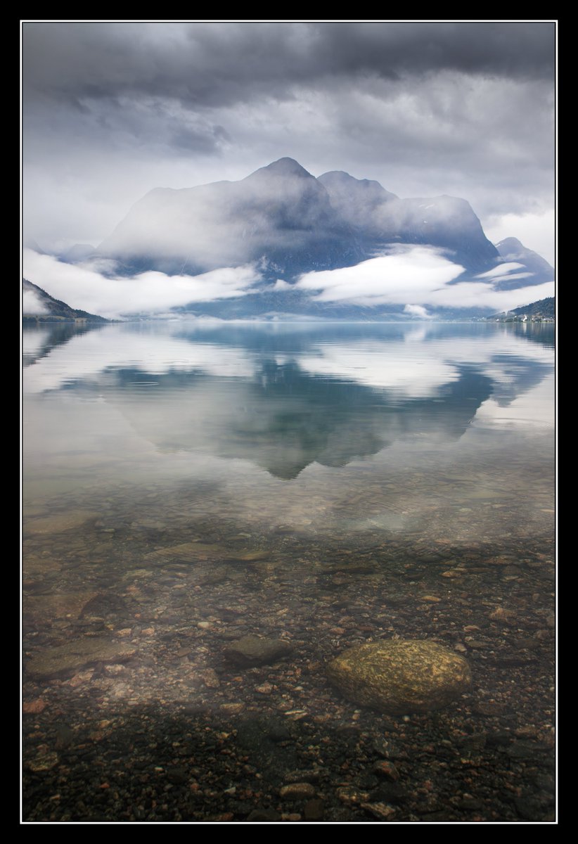 A misty morning at Oppstrynvatnet.

The lake sits at 29m above sea level and the mountains behind rise up to over 1400m! The photo catches the dramatic and ever changing mist but it's difficult to comprehend the scale and sheer size of the mountains unless you're there in person.