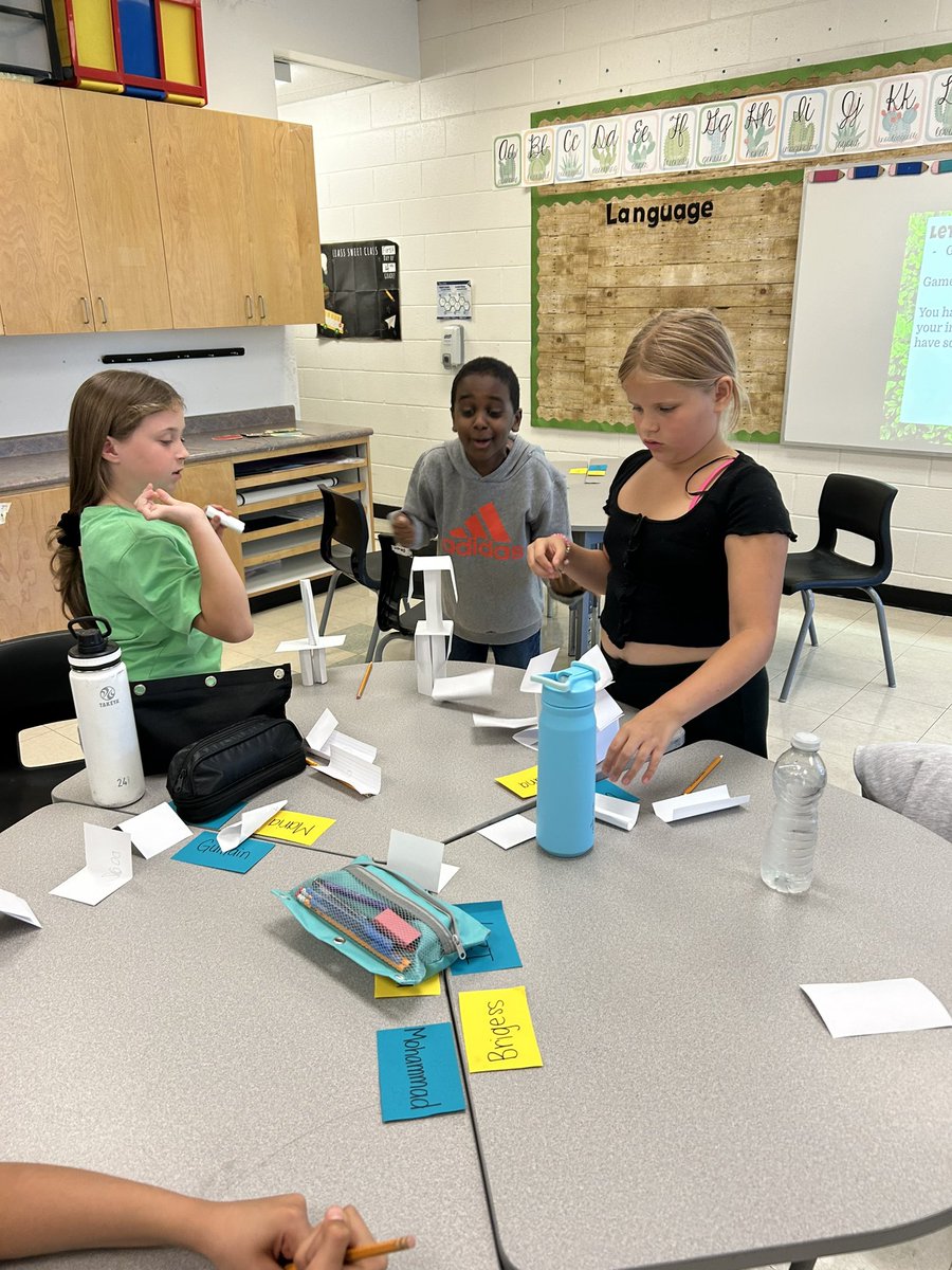 MsWood26's tweet photo. Last week some of the @StElizabethOCSB Grade 4s and 5s had fun mixing get-to-know you games with STEM challenges! In this game they made towers out of index cards, but they had to write or draw things they had in common on each one. #ocsbBeCommunity https://t.co/xc3gGNyqsb