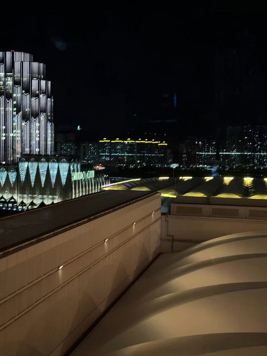 While exploring the dazzling city lights of Macau at night, I took a selfie that perfectly captured the vibrant glow of the skyline, with its iconic landmarks sparkling in the background, creating a memorable snapshot of my unforgettable evening adventure.