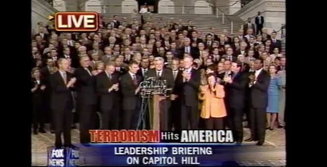 Members of Congress join on the steps of the United States Capitol and sing "God Bless America".