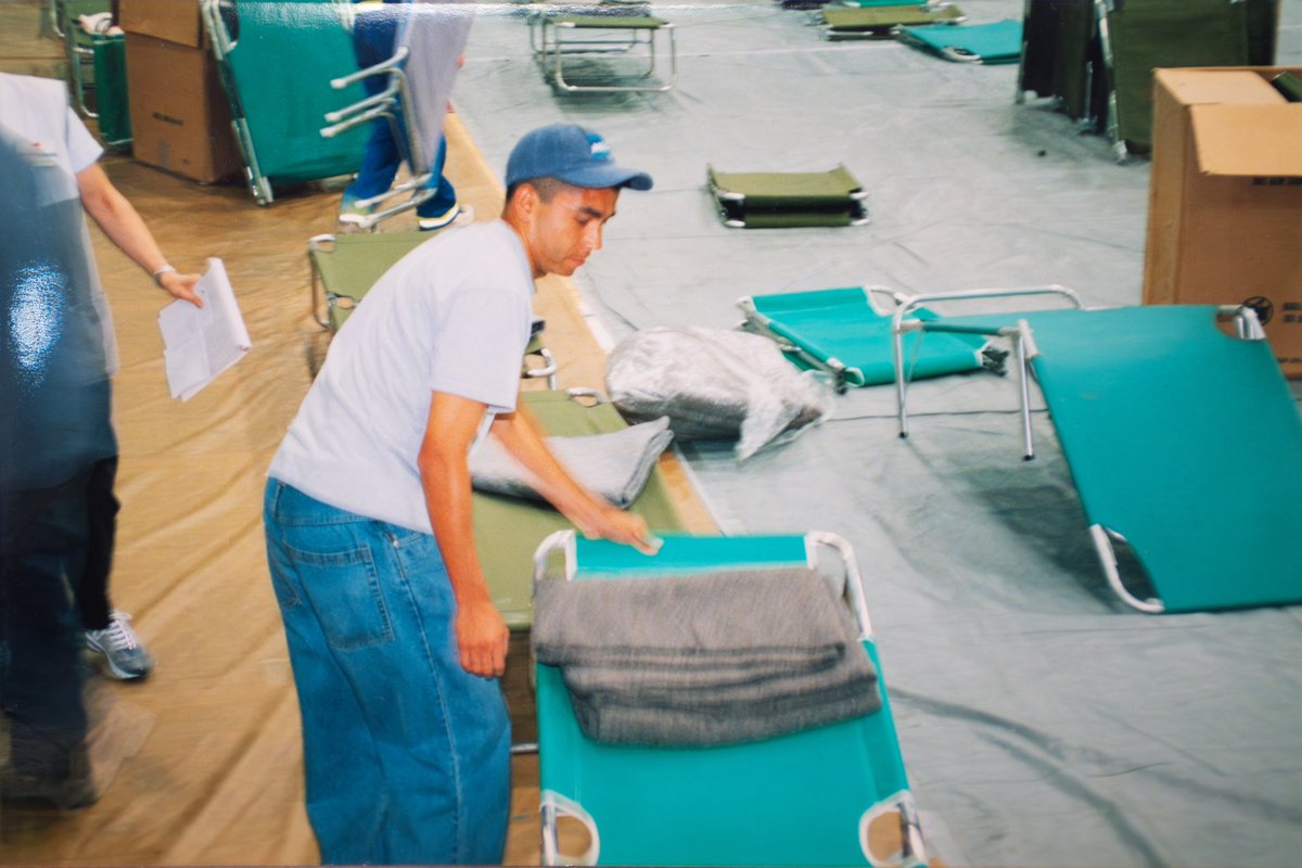 FDUKnights's tweet photo. In memory of those we lost on 9/11/2001. We will never forget. 

These photos are of the Bogota Savings Bank Center (then known as the Rothman Center) when the Red Cross set up a shelter at FDU for those seeking safety after the attacks on September 11, 2001. 

#uKNIGHTED | @FDUWhatsNew