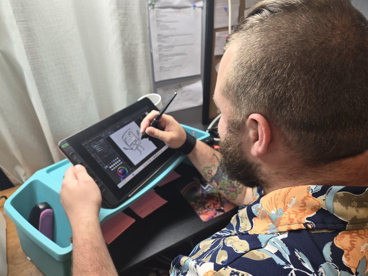 nuke30studio's tweet photo. My wife snapped some rare photos of me! Here’s a  behind-the-scenes look at me working on my webcomic. (This is just a warm-up doodle) I’m excited to share the journey with you all. Stay tuned for more updates and some sneak peeks)! #webcomic #artistlife #comicsinprogress https://t.co/YXI87TEZN2