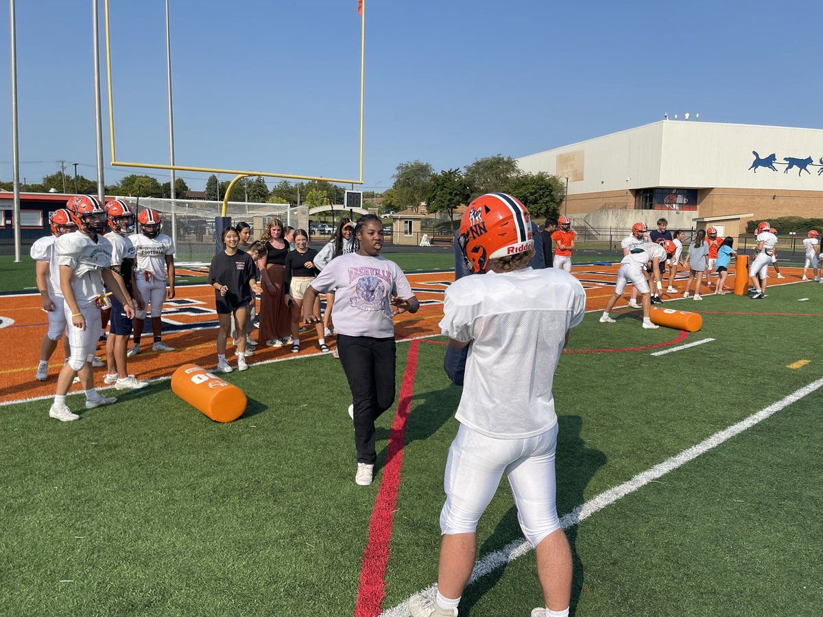 NNHS_Athletics_'s tweet photo. Today was a special day at Naperville North as our football team welcomed their teammates from the Multi-Needs Program for our first-ever Best Buddies Practice!

This marks the start of a new tradition.  @huskiefb did a fantastic job starting us off in building bonds that go beyond the field.  Great work to our teacher supporters and student PEER’s!

Driven to COMPETE