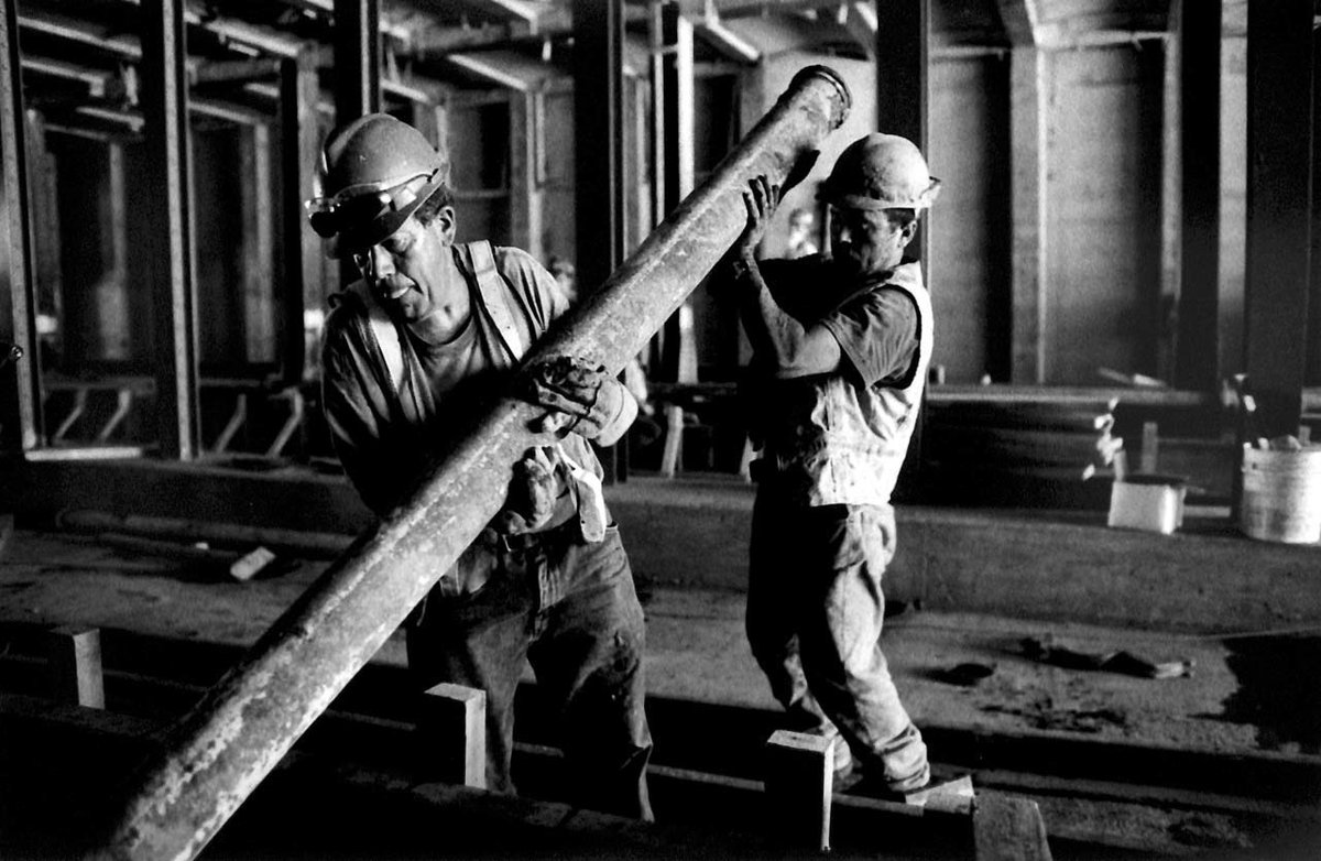 These photos by Sam Hollenshead show construction workers rebuilding a damaged section of the 1/9 train line in Lower Manhattan after the September 11 terrorist attacks. Amazingly, the last beam was put in place in July 2002, only five months after construction began.