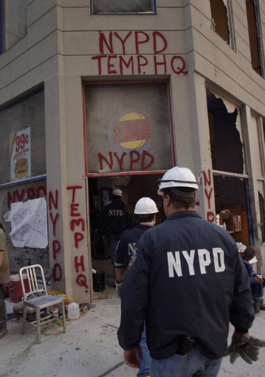 26. NYPD entering a temporary HQ in a Burger King after September 11, 2001.