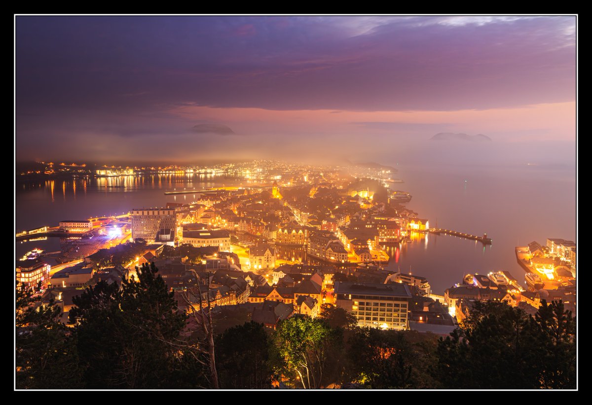 Ålesund during a foggy sunset.