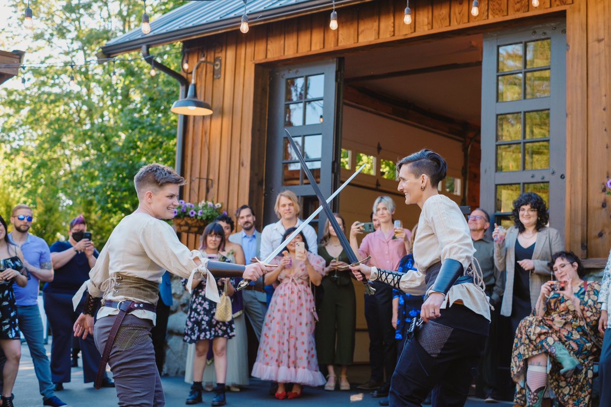 renblakely's tweet photo. My wife and I got married in June and don’t think I ever shared some of the pictures we got of our choreographed sword fight (which replaced our first dance)! I was so stoked about Chappell Roan’s VMA performance as a fellow sword lesbian ⚔️ https://t.co/E7nq0CB4fB