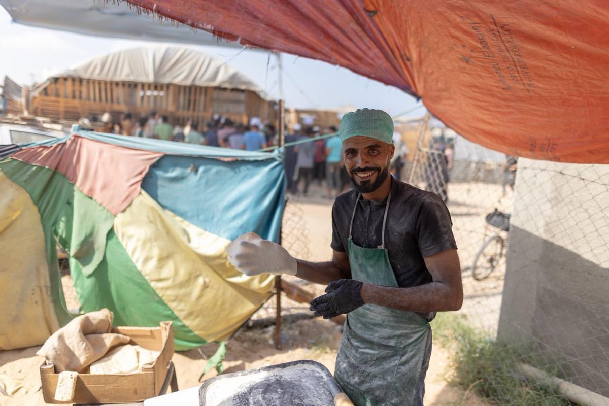Before the war, Dr. Akram was a media professor—he now leads a WCK community kitchen in Khan Younis. He and his team use WCK-provided pellet stoves and ingredients to prepare hundreds of hot meals every day. They also have a small bakery to make saj, a traditional flatbread
