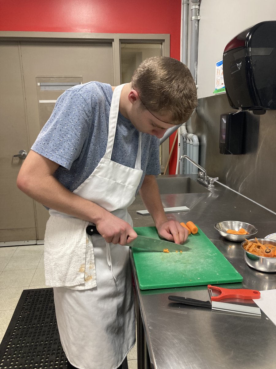 Our students are back!  Here's one of our students in their first culinary lab, developing knife skills, in one of many practical labs available the college.  We're off to a good start this year!
