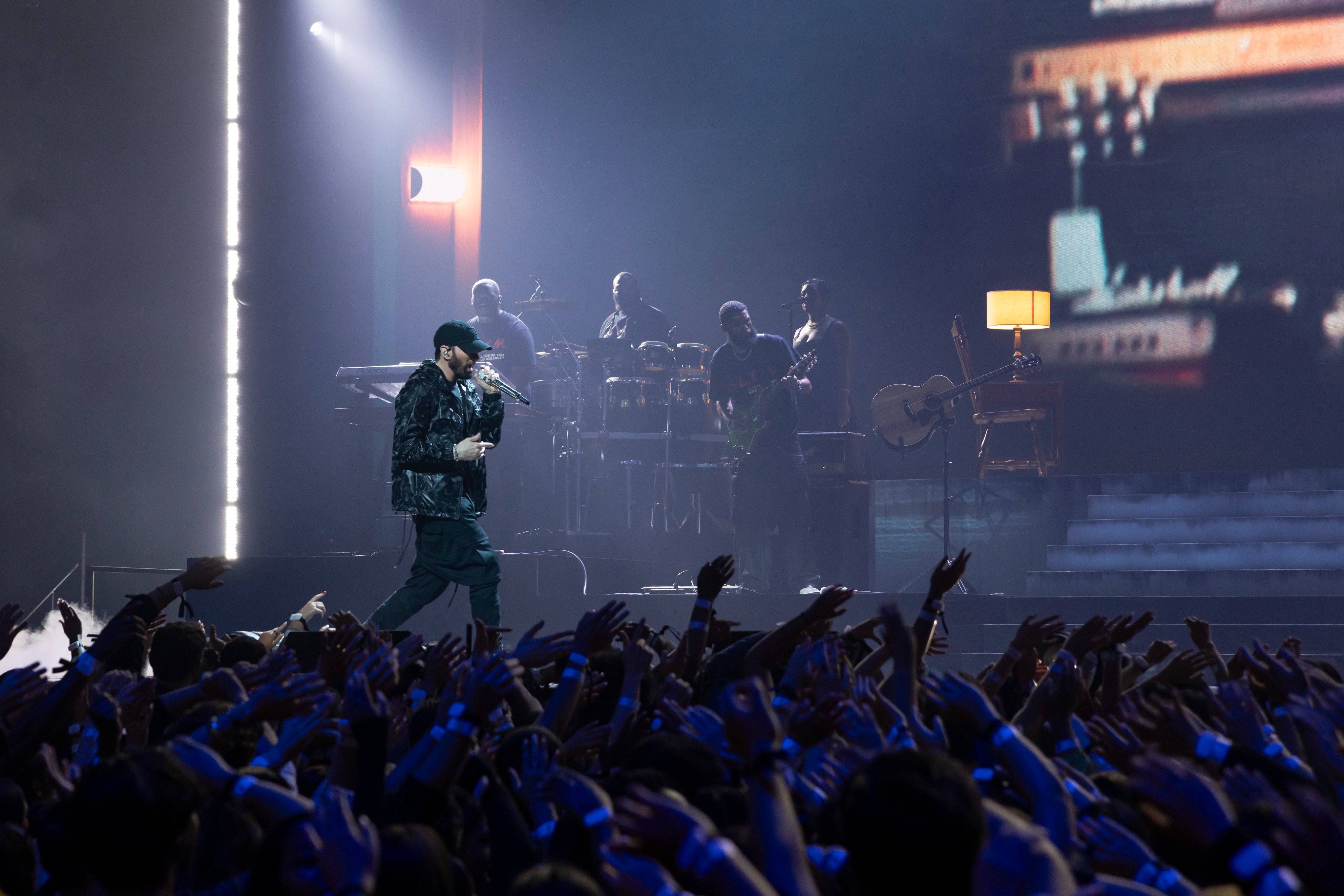 Eminem hands covering face