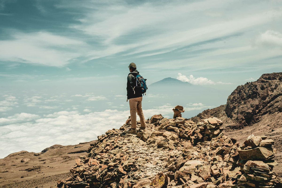On the edge of the world, where solitude meets the sky, each step forward is a journey inward, uncovering strength and spirit.