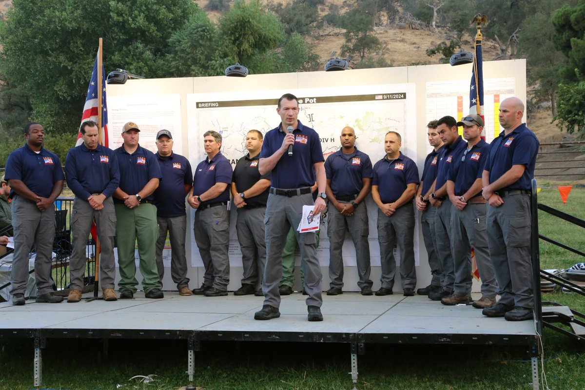 FDNY's tweet photo. The FDNY's commemoration of September 11 spanned the country. In Idaho and California, more than 45 members of @FDNYIMT are operating at two separate wild land fires. Wednesday morning, each team marked the 23rd anniversary of the attacks during their morning operations brief. https://t.co/PeuU9S40jo