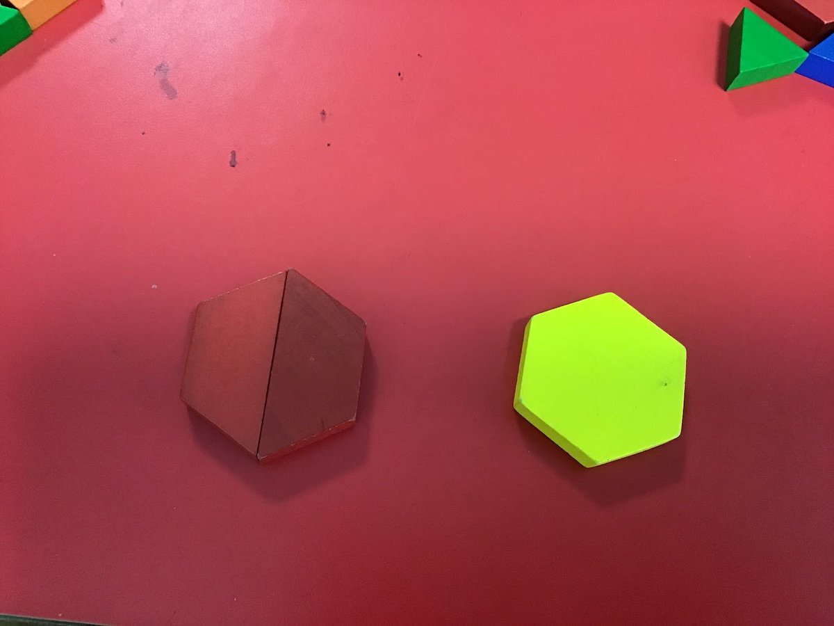 A 4-year old student observes that two of the red shapes make the yellow one. Photo opportunity.... 

Follow-up question: 'Do any other shapes make that shape?'