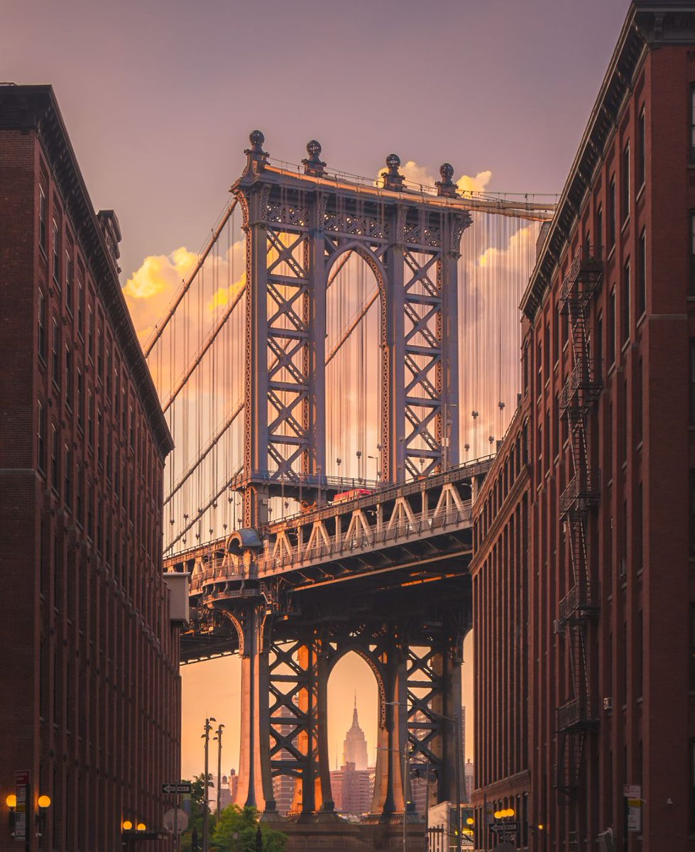 SoEarthen's tweet image. Manhattan Bridge from Brooklyn, NYC - The iconic view of the Manhattan Bridge seen from a brick street in Brooklyn, New York City, in the evening. #ManhattanBridge #Brooklyn