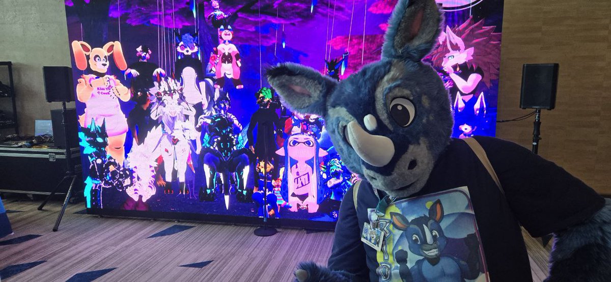 It is weird being on this side of the #VRChat  #FURALITY portal. #Megaplex2024 #FursuitFriday #fursuiter  #FURRY #Rhino