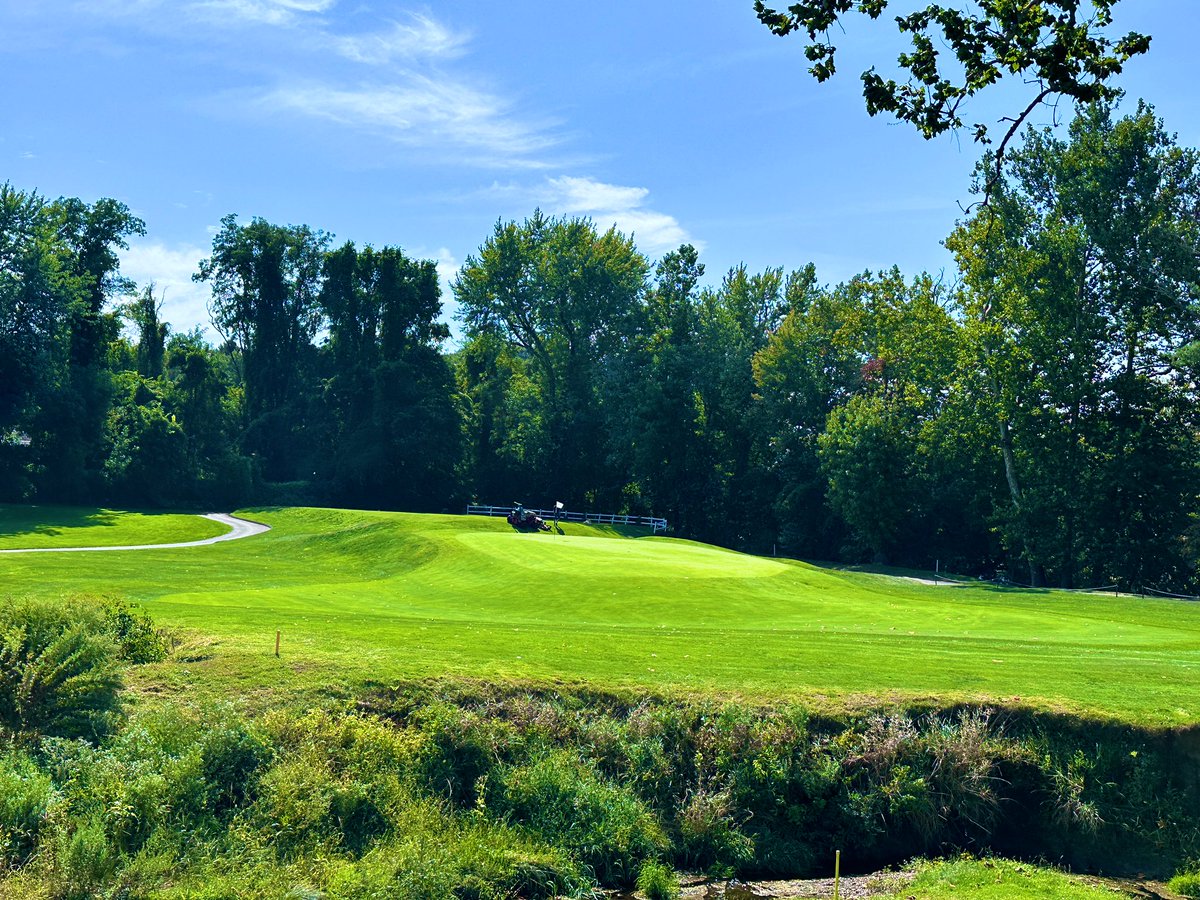 Top100Rick's tweet photo. Country Club of Farmington - 1924
Devereux Emmet 

💎💎💎 HIDDEN GEM ALERT!!! 💎💎💎

I’ve been on an Emmet run lately and he has very quickly ascended my list of must play architects. His courses, when properly maintained, are as fun and quirky as you will find. 

CCF is a true throwback club. It has all the qualities you find in a club that defends its roots. The classic, wood floored and paneled lounge. The classic patio overlooking 1 and 18. The quirky short par 4 starter and long par 3 finisher. The wild greens. It’s so good. 

The highlight are the greens, which are DIABOLICAL! Super sloped and fast, we chipped and putted off the greens multiple times. When your host says “stay below the hole” here, he means it. I hit some amazing chips that slowly trundled 30 yards away. 

The course has 2 distinct sections. The early and late holes are on a higher level, with tons of land movement. The middle section runs along a river and is extremely flat. While the higher level holes are the better holes, the lower level holes have some great strategic elements, including a meandering creek and some wonderful green design elements. 

The course is only around 6500 yards from the tips, but that doesn’t mean it’s easy. The treacherous greens means double lurks even after being on or near the green. I speak from experience. 

An incredible day with a great host. If you can, try to find your way here. You will have a blast.
