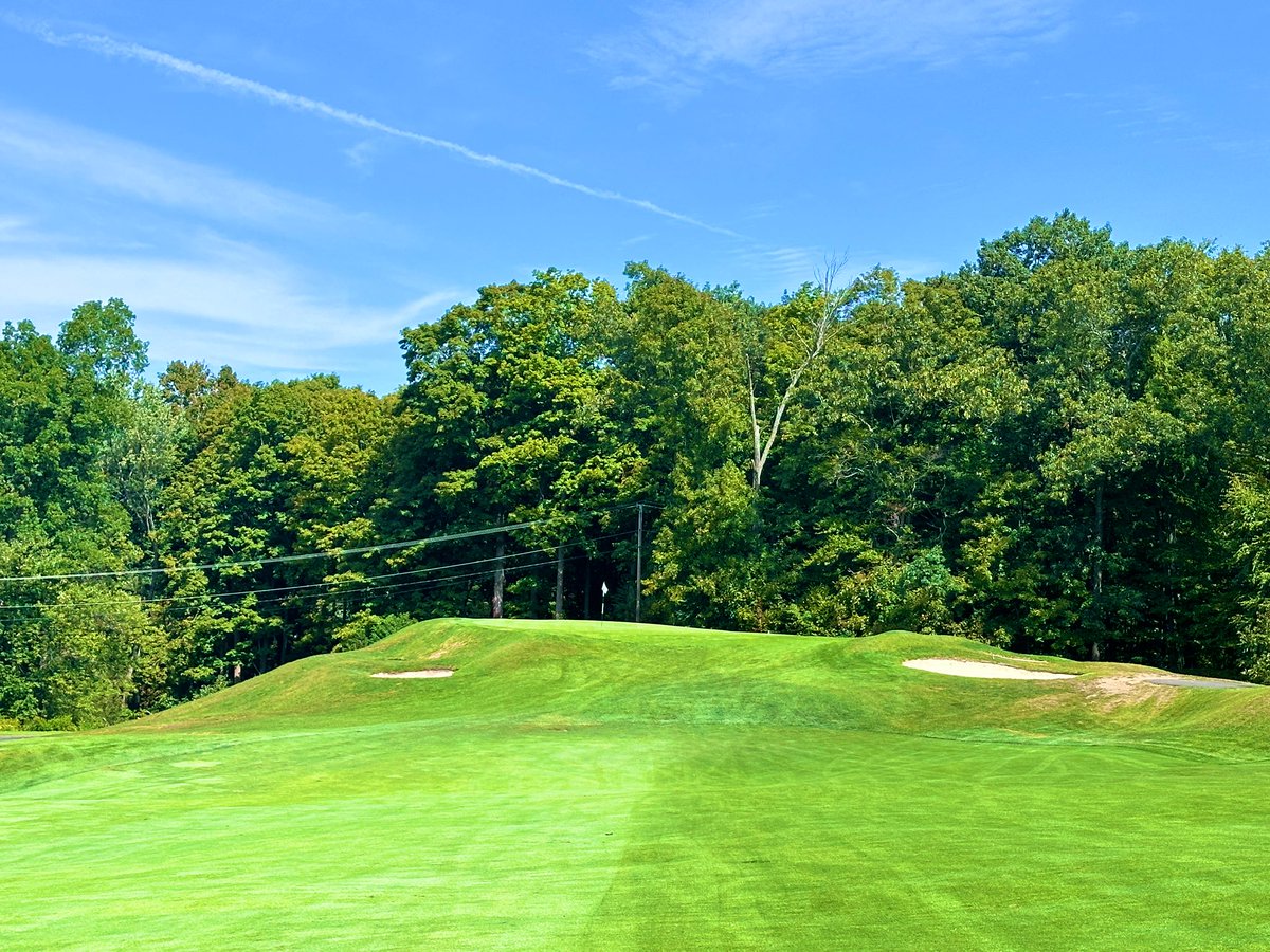 Top100Rick's tweet photo. Country Club of Farmington - 1924
Devereux Emmet 

💎💎💎 HIDDEN GEM ALERT!!! 💎💎💎

I’ve been on an Emmet run lately and he has very quickly ascended my list of must play architects. His courses, when properly maintained, are as fun and quirky as you will find. 

CCF is a true throwback club. It has all the qualities you find in a club that defends its roots. The classic, wood floored and paneled lounge. The classic patio overlooking 1 and 18. The quirky short par 4 starter and long par 3 finisher. The wild greens. It’s so good. 

The highlight are the greens, which are DIABOLICAL! Super sloped and fast, we chipped and putted off the greens multiple times. When your host says “stay below the hole” here, he means it. I hit some amazing chips that slowly trundled 30 yards away. 

The course has 2 distinct sections. The early and late holes are on a higher level, with tons of land movement. The middle section runs along a river and is extremely flat. While the higher level holes are the better holes, the lower level holes have some great strategic elements, including a meandering creek and some wonderful green design elements. 

The course is only around 6500 yards from the tips, but that doesn’t mean it’s easy. The treacherous greens means double lurks even after being on or near the green. I speak from experience. 

An incredible day with a great host. If you can, try to find your way here. You will have a blast.
