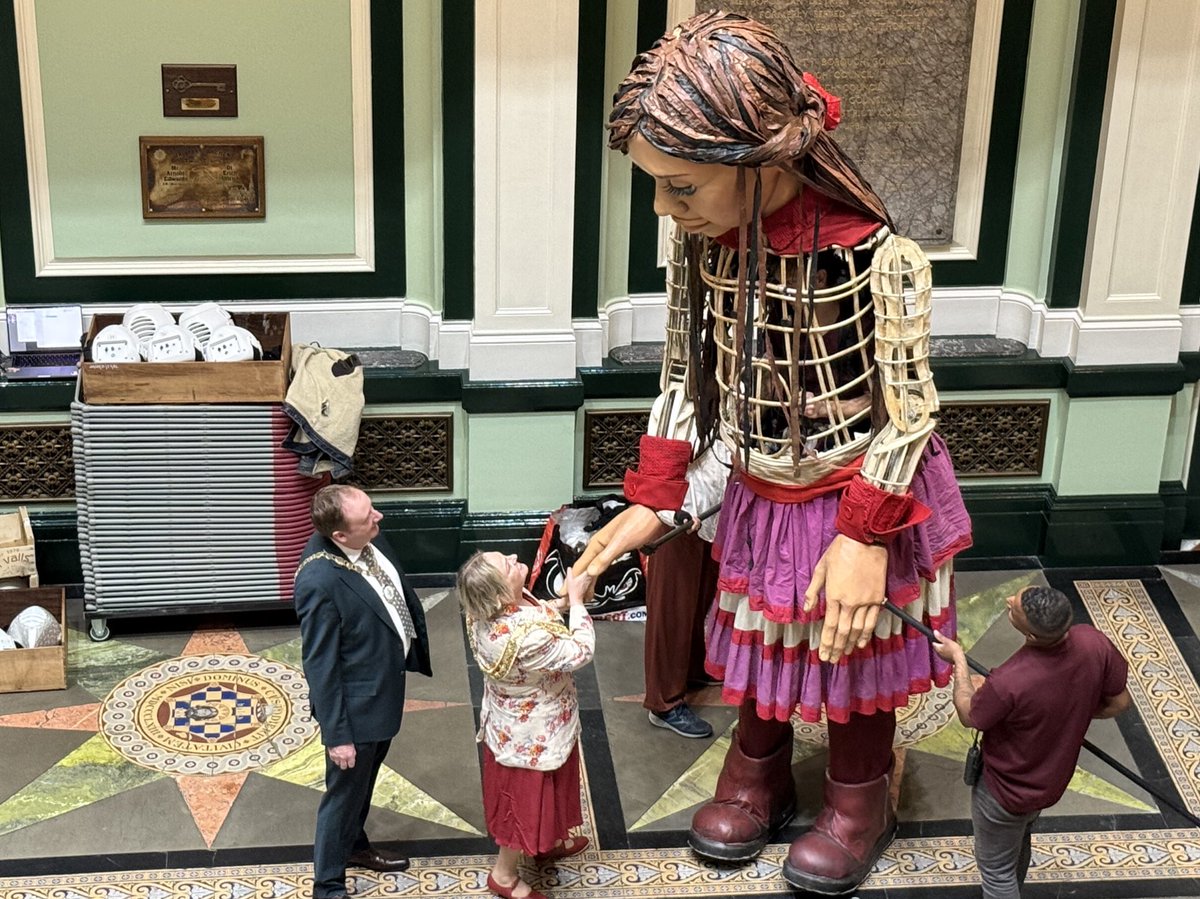 Mayor of Calderdale, Cllr Ann Kingstone is greeted by Little Amal, the iconic 12 foot puppet of a ten-year old refugee girl at Halifax town hall, before she begins her symbolic journey to <a href="/ThePieceHall/">The Piece Hall</a> at 11am.

You can join the start of the walk from the Town Hall at 11am.