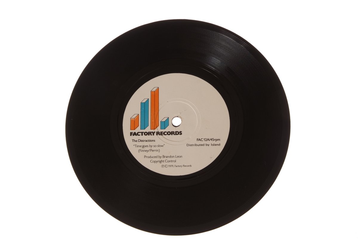 Fac 12 The Distractions Time Goes By So Slow 7" single  September 1979 forty five five years ago this month, fac logo on center label now in color. At my 1st exhibition in 2011 at The Ducie Bridge in Manchester a librarian told me the fac discography was set out all wrong ?
