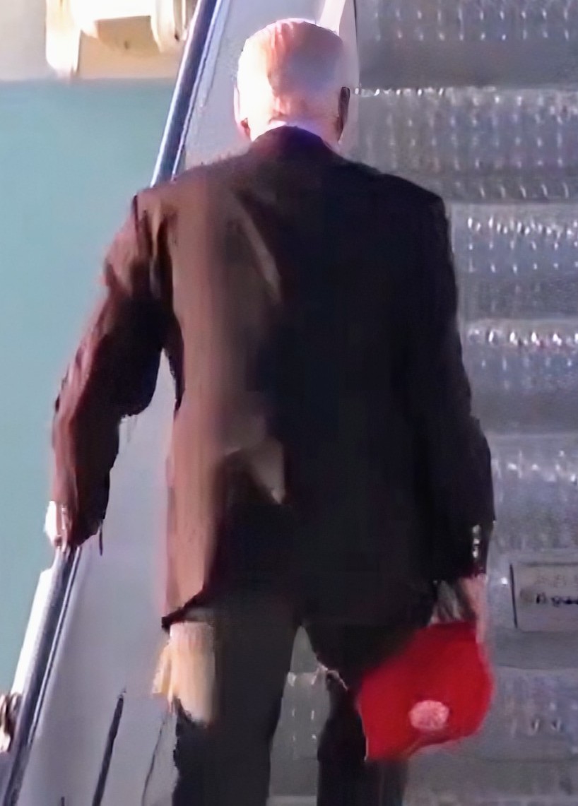 CompanionOfTime's tweet photo. @RogerJStoneJr Unfortunately, it's not a DJT hat.  Looks like a circled symbol. Let's dig a bit deeper. https://t.co/waIqPzMRuW