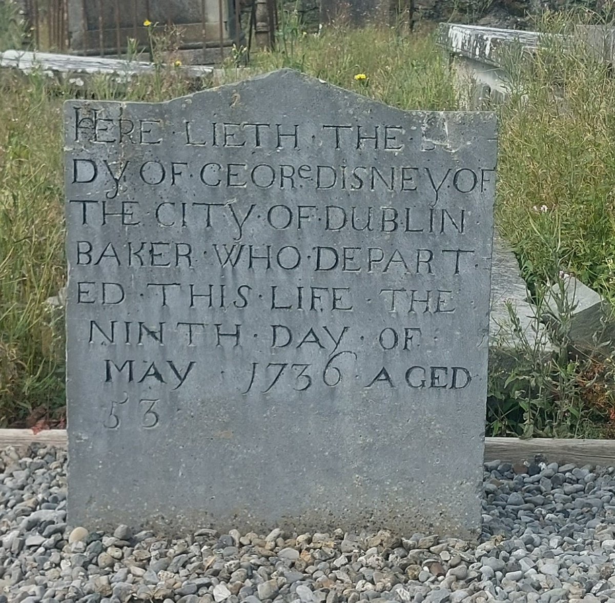 carlowgraveyard's tweet photo. Headstone in memory of George Disney, who 'departed this life the ninth day of May 1736', Wells graveyard, Carlow. He's an ancestor of Walt Disney @Disney https://t.co/jbTexmeLLs