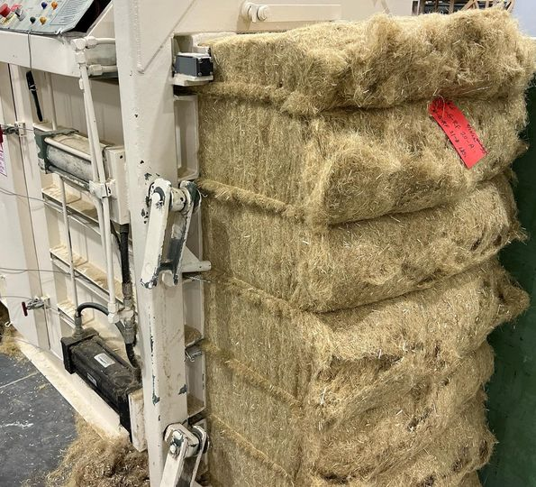 IND_HEMP's tweet photo. Foggy and moist in North Central Montana 🌫️. Here’s a drone shot of the IND HEMP facility: trucks unload hemp straw for processing. The decortication process separates bast fiber and hurd, essential for products like and animal bedding. #HempProcessing #SustainableMaterials https://t.co/1wqhZXMwEZ