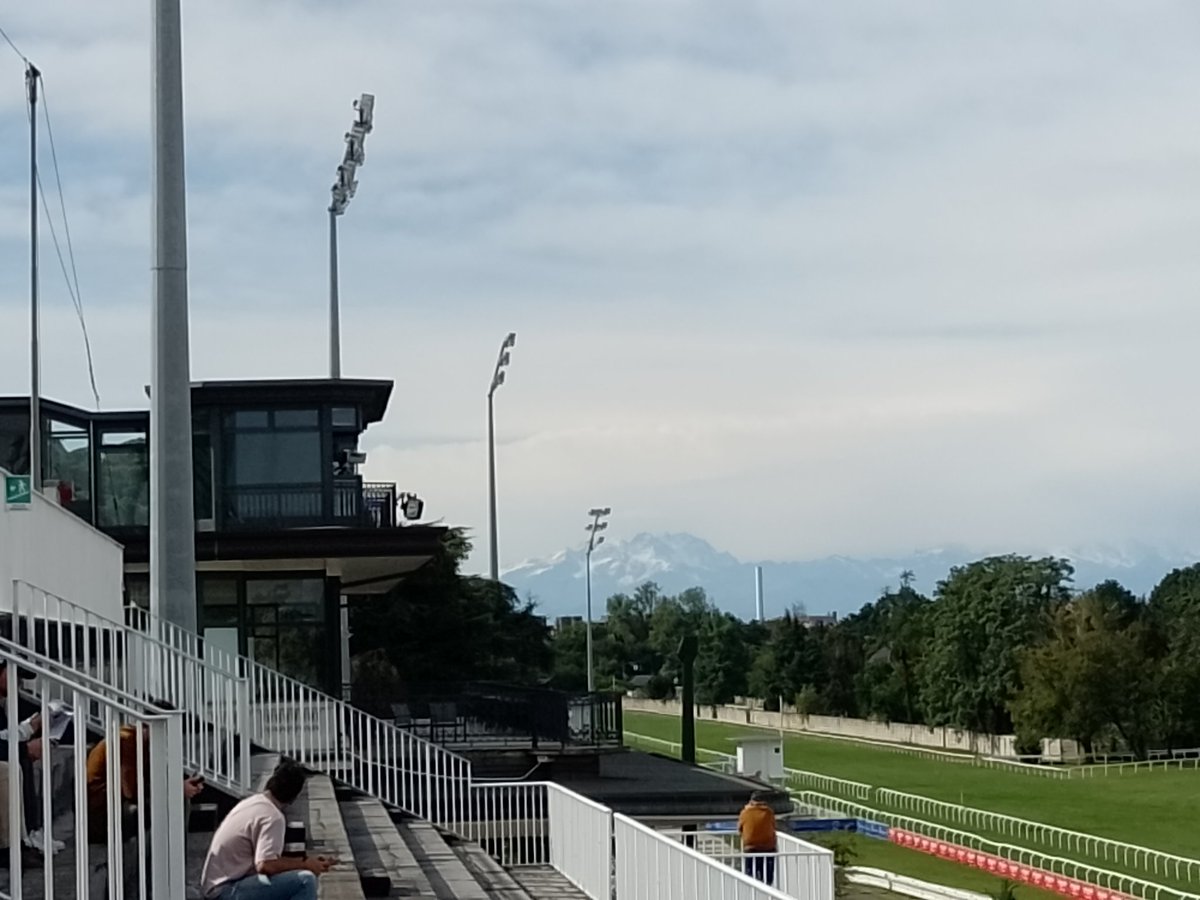 iggy_owl's tweet photo. Lovely afternoon at Milan San Siro racecourse snow covered Alps in the distance. https://t.co/RToATqfKZi