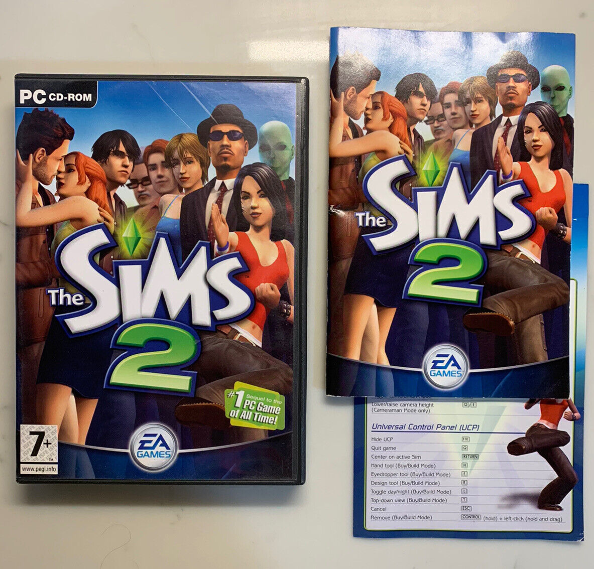 The Sims 2 was released 20 years ago today. The original box came with 4 installation discs