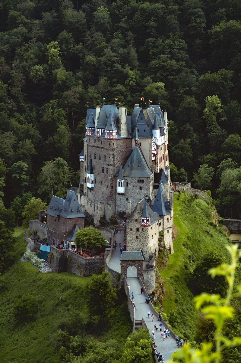 Eltz Castle is one of the best-preserved castles in Germany. It is located in a quiet valley in the small town of Münster-Maifeld, Germany. It was built between the 12th and 16th centuries AD and is like a fairy tale.