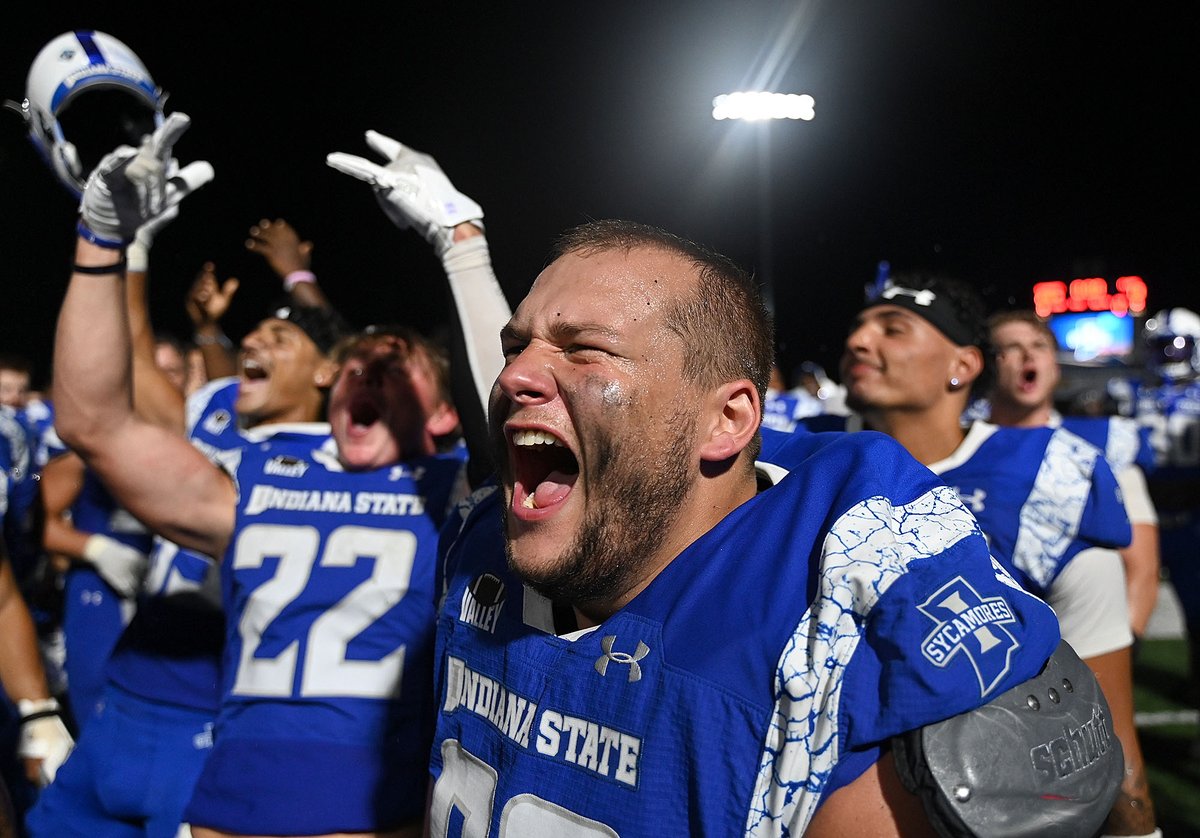 TribStarJoe's tweet photo. Indiana State's Jack Sherman celebrates with his teammates and fans after the Sycamores' 24-13 win over Dayton on Saturday at Memorial Stadium. https://t.co/SnYmK5MTwi
