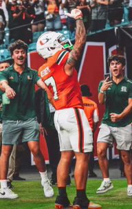 hbertgomez's tweet photo. Canes wide receiver Xavier Restrepo scoring tonight in a 62-0 rout of Ball State and @Eric24Gomez_ on the field catching a video. 

@BaseballJesuit https://t.co/rDYXUcR0Zl