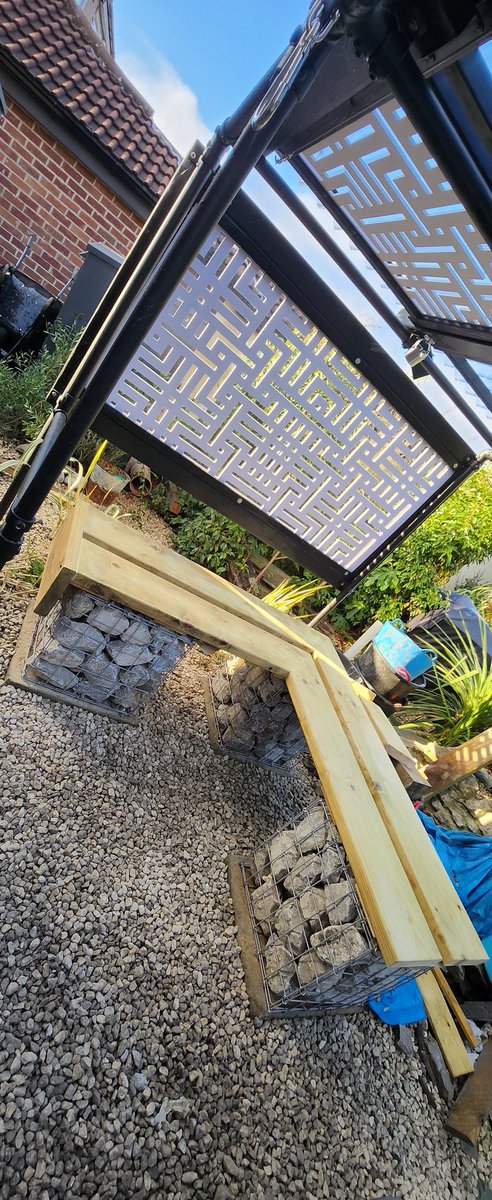 Today's DIY was finishing off an L shaped bench with <a href="/WireFenceHelp/">Wire Fence</a> PVC coated gabion baskets, dove grey rock from <a href="/MainlandAggsLtd/">Mainland Aggregates</a> &amp; tanalised planed timber from <a href="/EstateSawmills/">Michael</a>.

The final step is the varnishing...