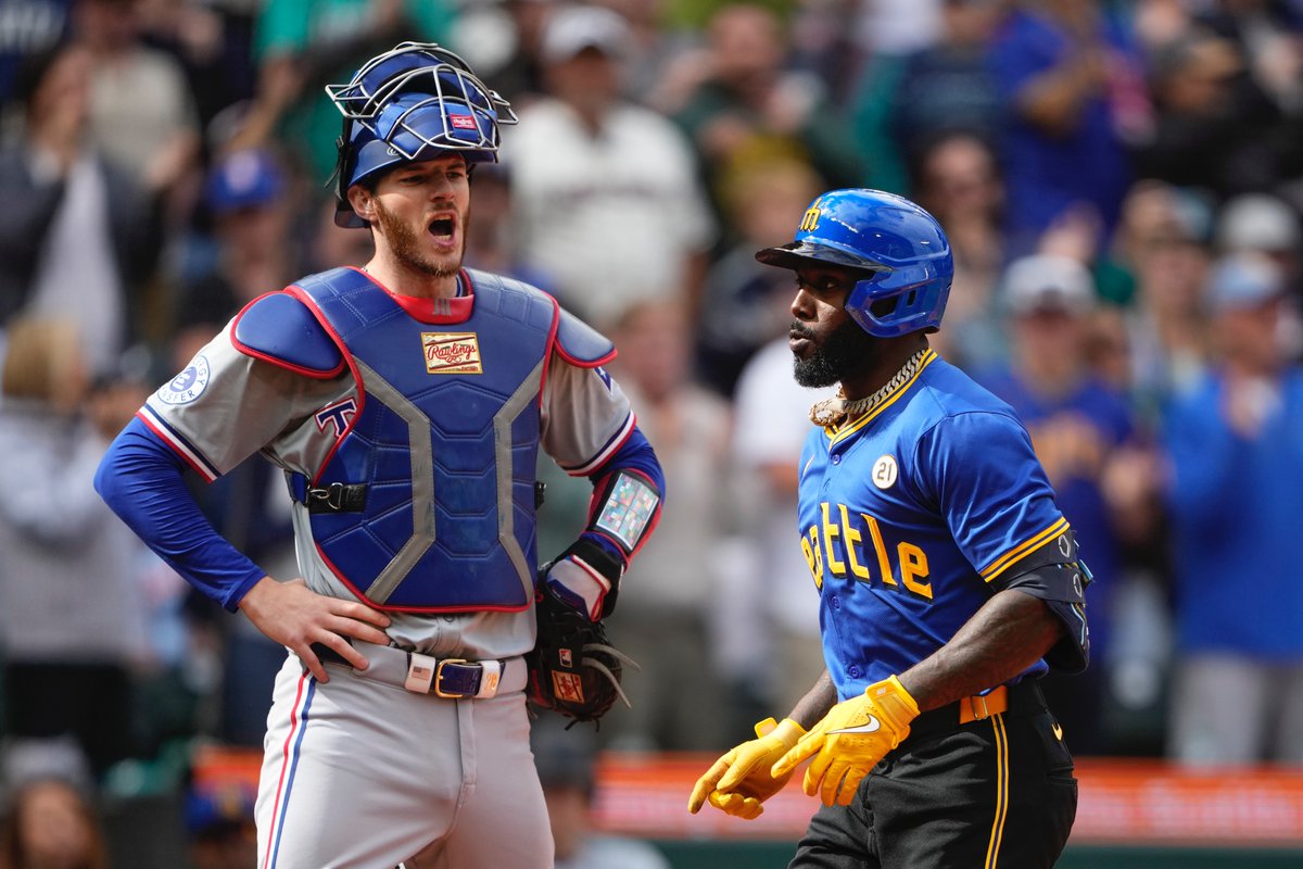 lindseywasson's tweet photo. #Rangers catcher Jonah Heim yells at Seattle #Mariners' Randy Arozarena as he jogs home while celebrating a solo home run in the seventh inning. https://t.co/LPaobJ3s7t