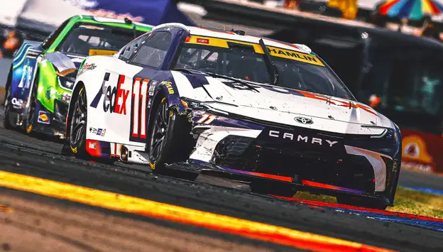 FaneJeff25655's tweet photo. Chaos on the Track: Hamlin and Keselowski Struggle as Buescher Snags Victory at Watkins Glen

Chris Buescher took the win at Watkins Glen, upsetting the playoff hopes of several contenders. Despite being out of the playoffs, Buescher claimed victory in a dramatic race, leaving top drivers like Denny Hamlin and Brad Keselowski scrambling to secure their spots in the next round. 

Hamlin’s day started poorly as he was involved in two accidents, including one on the opening lap, which pushed him to a 23rd-place finish. Now, he's six points behind the playoff cutoff. Hamlin acknowledged that his weak qualifying position led to the early crashes. He remains optimistic about his chances at Bristol, a track where he’s had great success, but he needs a strong performance to stay in the playoffs.

Keselowski faced his own set of problems, including a wild incident where William Byron’s car ended up on top of his. He finished 26th and is 12 points out of contention. Despite the setback, Keselowski feels confident heading into Bristol, where he has three career Cup wins.

Martin Truex Jr. also had a tough day, finishing 20th and falling 14 points behind in the playoff standings. The race saw several non-playoff drivers like Buescher, Shane van Gisbergen, and Ross Chastain dominate the top positions, further complicating the playoff picture.

Buescher’s win wasn’t without drama, as he battled van Gisbergen on the final lap, taking the lead after forcing a mistake. While there was some contact, both drivers agreed there were no hard feelings after the race. This victory marked Buescher’s first on a road course and his sixth career Cup win.