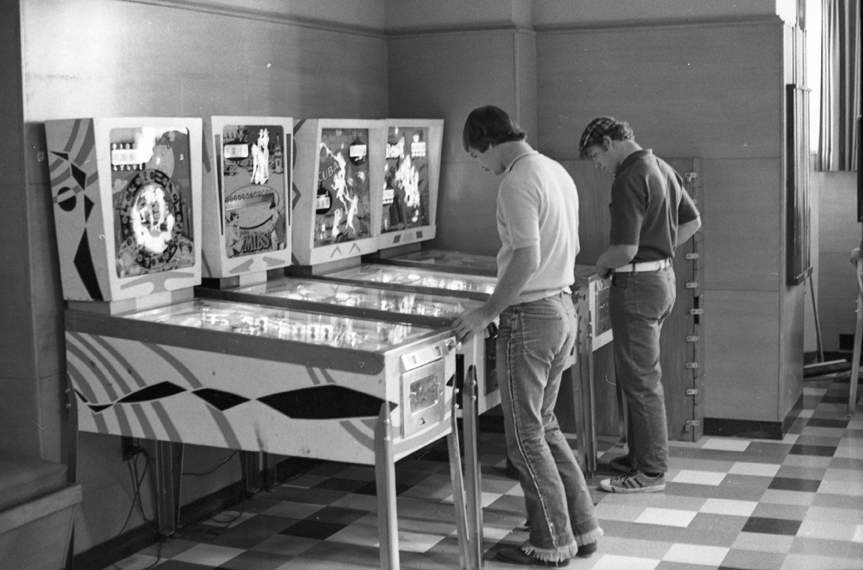 #DYK That the Union used to house pinball machines? This photograph, taken in September 1971, shows two men absorbed in their pinball games. The pinball machines are (from left to right): Aquarius (1970), MIBS (1969), Scuba (1970), and Roller Coaster (1971). #MSUHistory