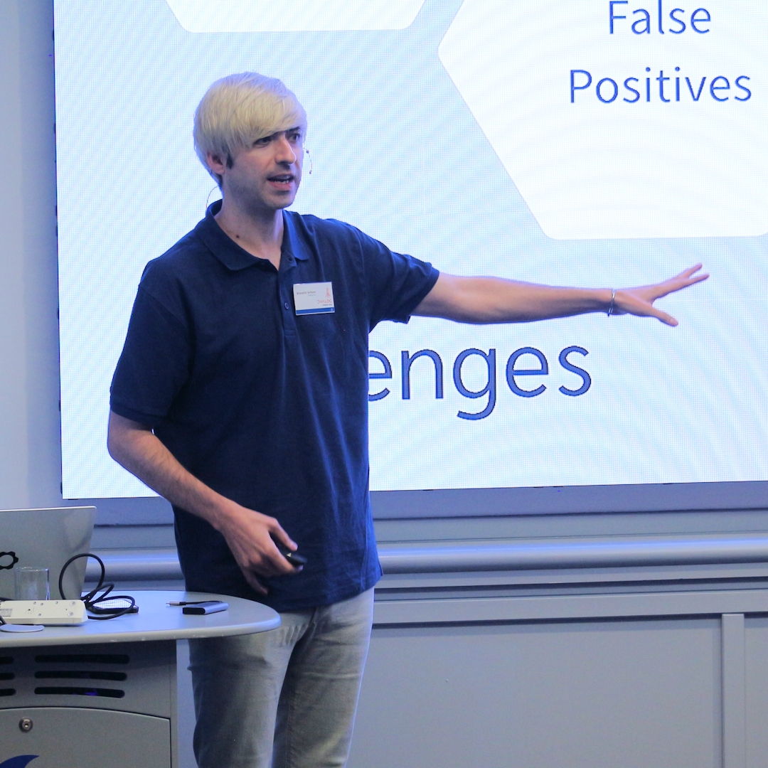 dyalogapl's tweet image. Brandon Wilson is now presenting at #Dyalog24, tackling one of APL’s unique challenges: verifying code correctness. Using the Co-dfns compiler, he’s developing a tool to analyse and specify properties of APL codebases. #APL #StaticAnalysis #CodeVerification #SoftwareDevelopment