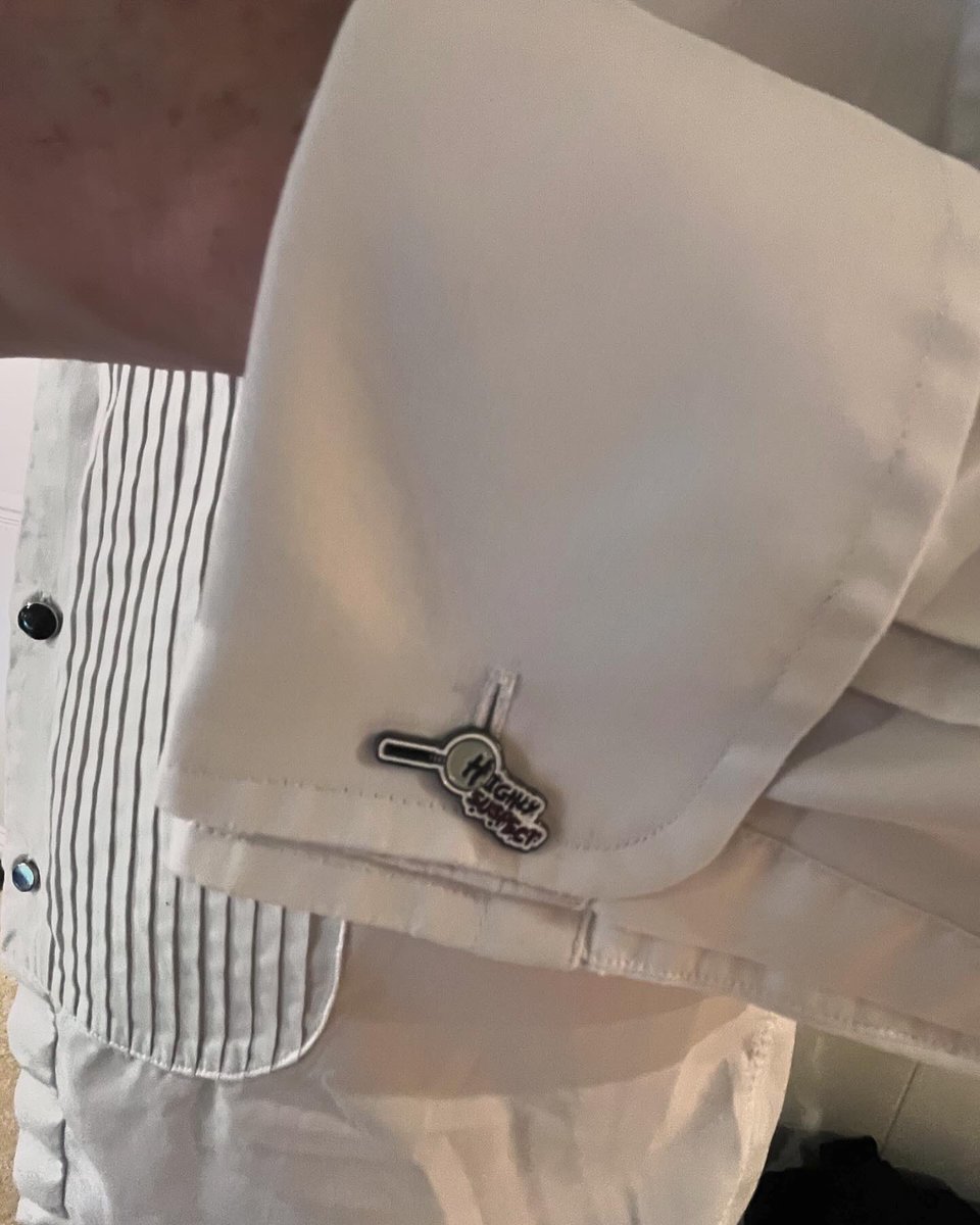 What an ingenious mind our Murderer-in-Chief has; when we forget to pack his cufflinks for his suit he improvised marvellously by using our Highly Suspect pin badges!