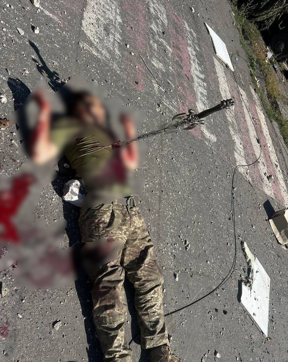 ‼️Another atrocity by the Russian terrorist bastards.‼️

Previously, a Ukrainian prisoner of war was brutally murdered and Russians stabbed a sword into his heart, with the inscription "For Kursk".

It is against such non-humans that Ukrainians are fighting.
