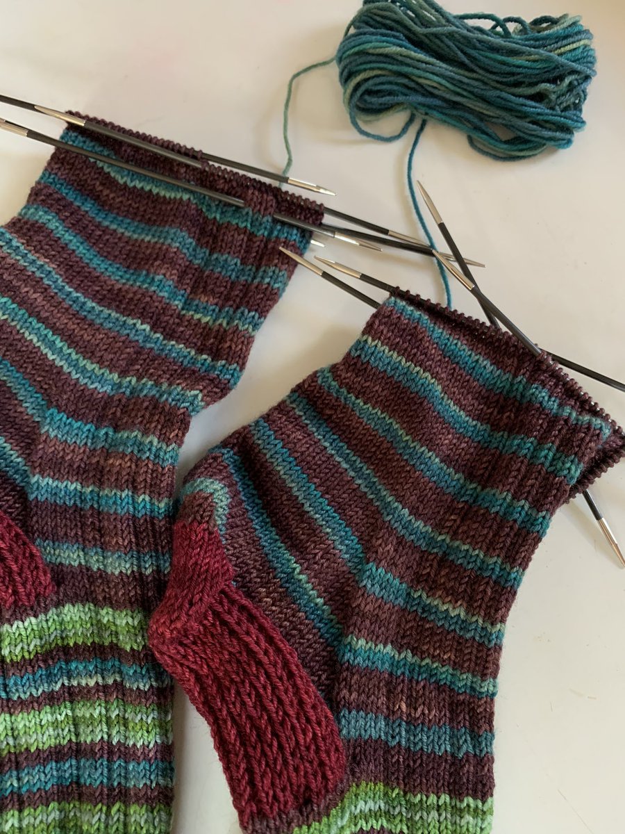 What to do when you don’t know if you will have enough yarn for the blue stripes on both socks? Play yarn chicken by working from both ends of the ball of blue yarn—at the same time—to try and get as many blue stripes as possible for each sock.